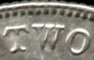 Curvature of letter bases on a 1931 florin