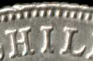 Curvature of letter bases on a 1931 florin